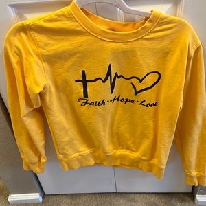 I’m selling a yellow sweater but it look darker in picture.
